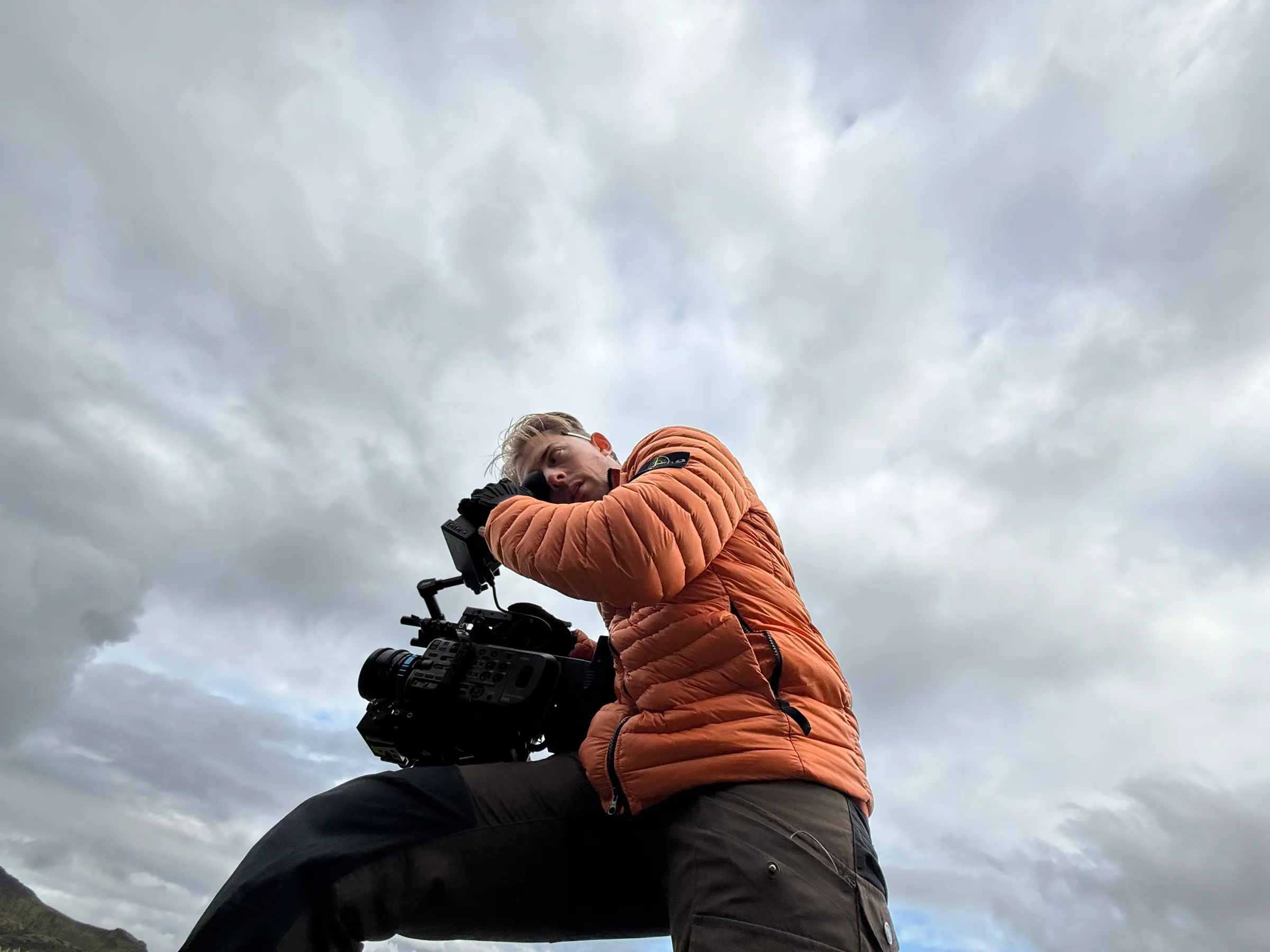 Michael behind a cinema camera under heavy Icelandic cloud